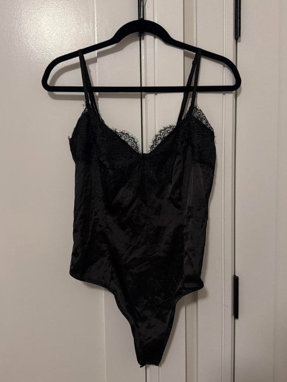 Black lace bodysuit with satin finish and lace trim